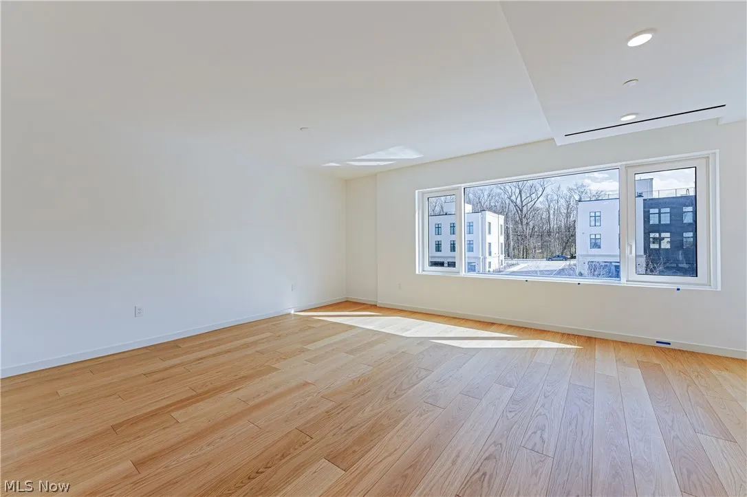 Spare room with light hardwood / wood-style flooring
