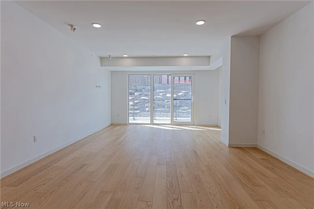 Unfurnished room featuring light wood-type flooring