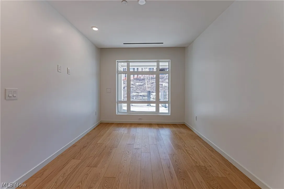 Spare room featuring light wood-type flooring