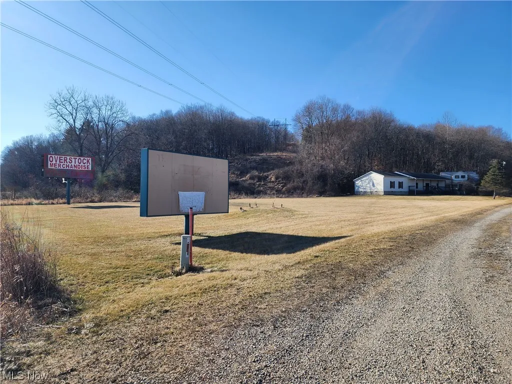 Community / neighborhood sign with a yard