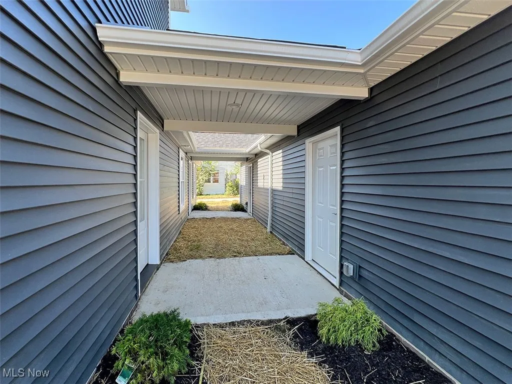 Covered walkway to garage man door