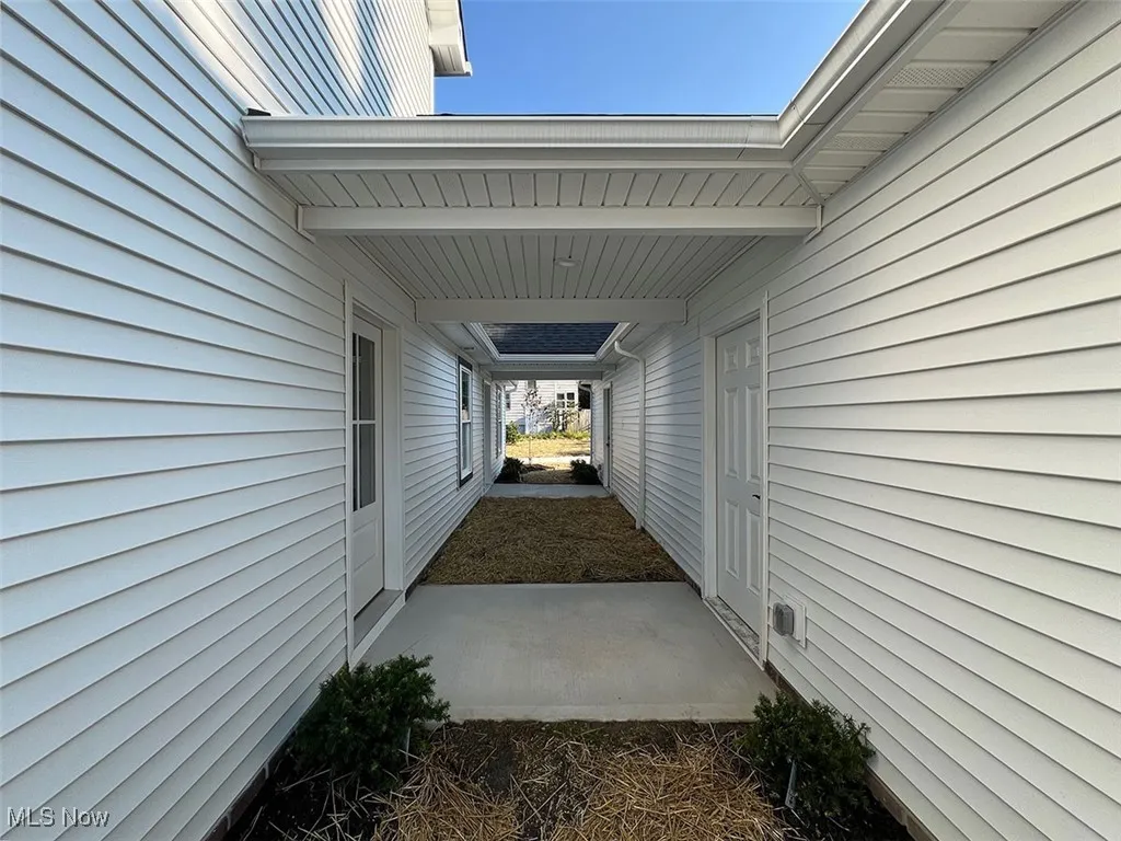 Covered walkway to garage man door