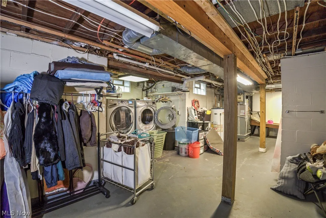 Basement featuring independent washer and dryer and gas water heater