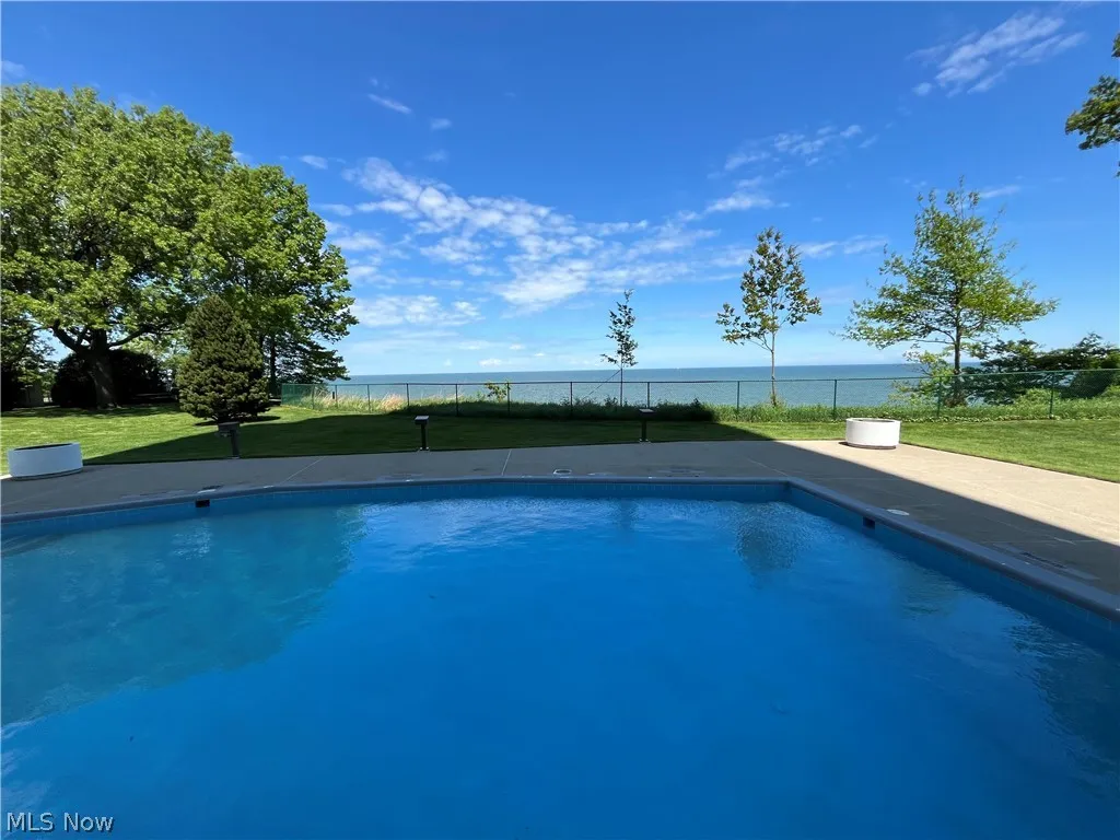 Outdoor pool overlooking lake area