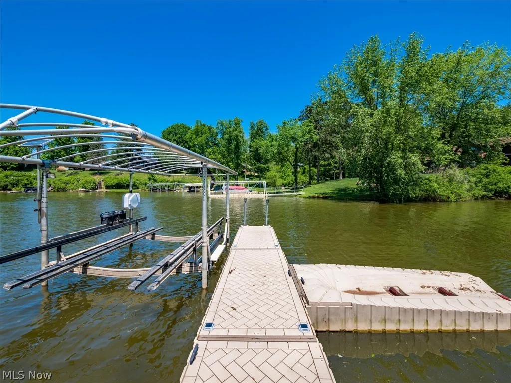 Dock area featuring a water view