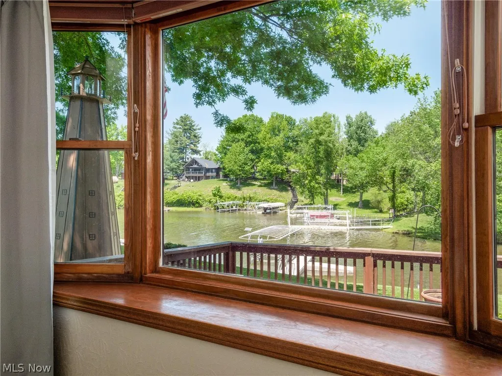Unfurnished sunroom with a water view
