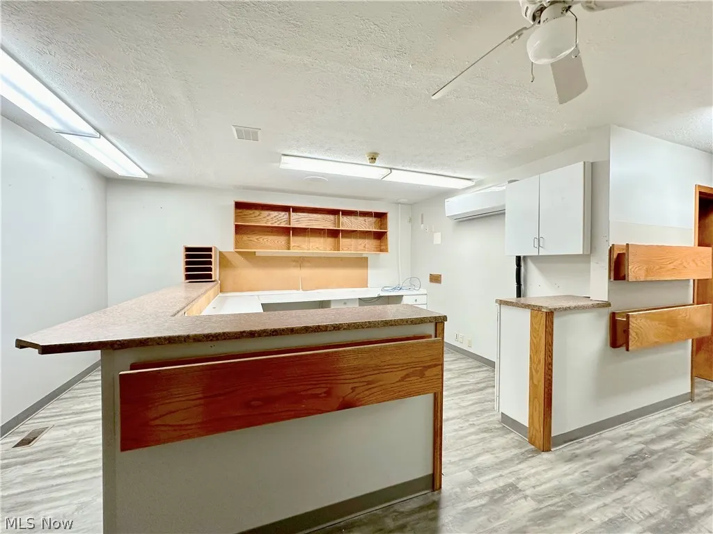 Large Reception Area that is flanked with multiple exam rooms