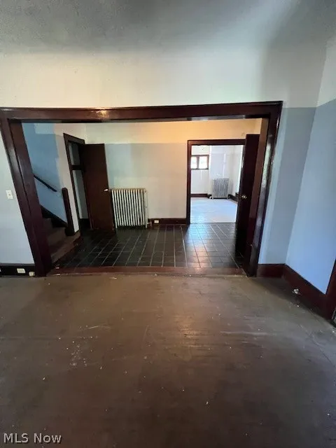 Hallway featuring radiator heating unit