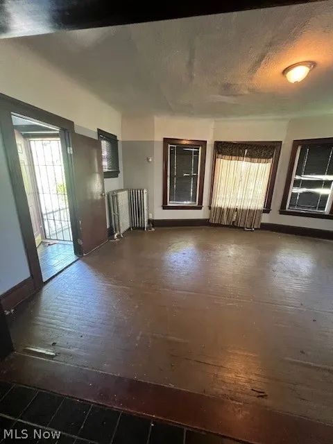 Unfurnished living room with radiator