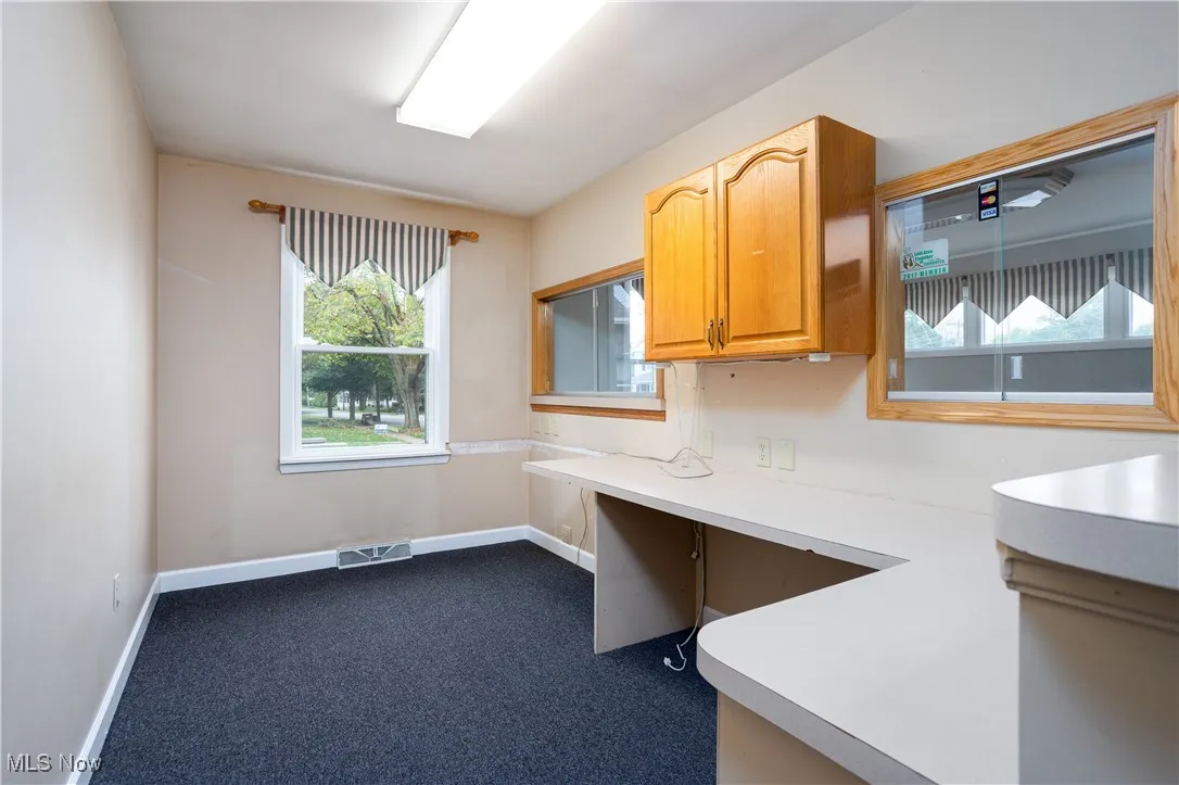 Unfurnished office featuring carpet