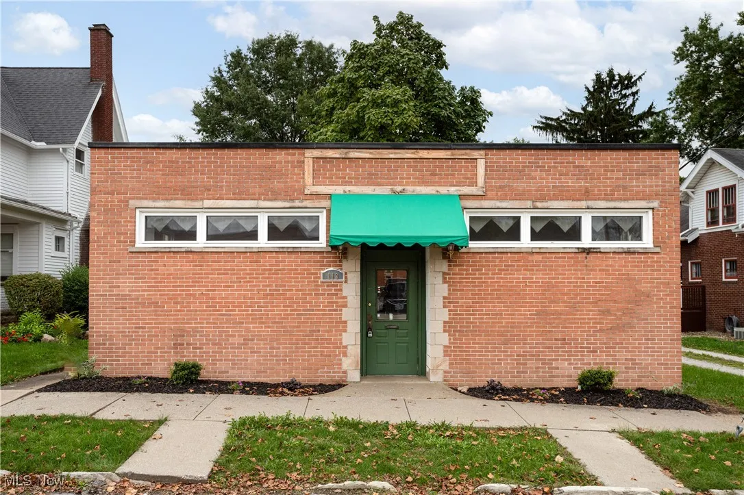View of front facade featuring brick siding