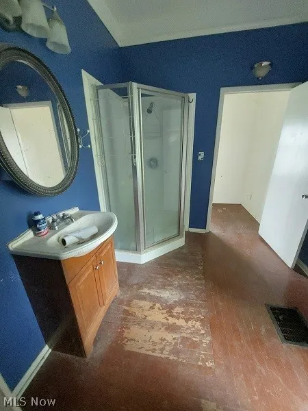 Bathroom with walk in shower and large vanity