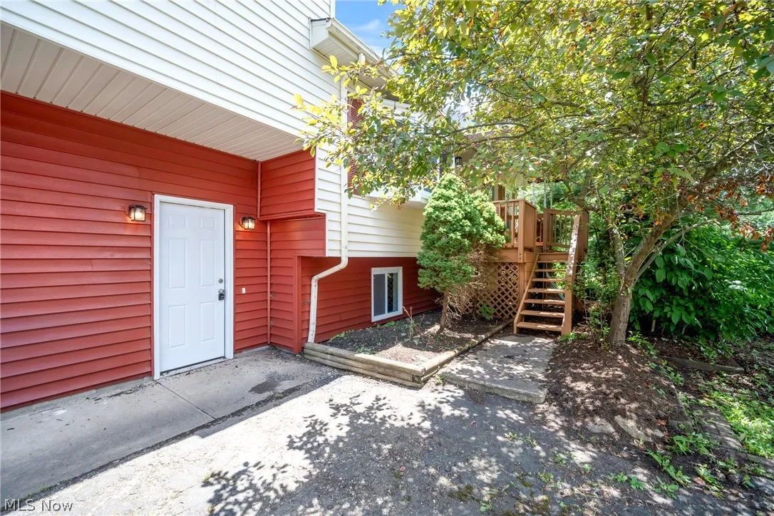 Doorway to property featuring a wooden deck