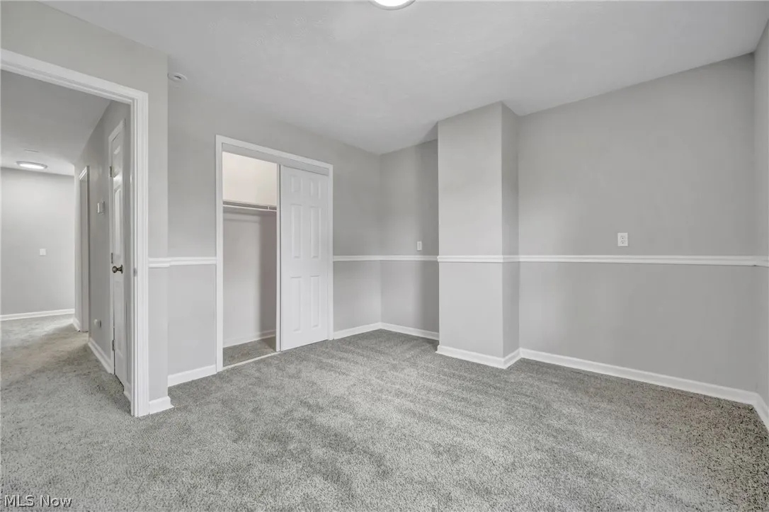 Bedroom with carpeting