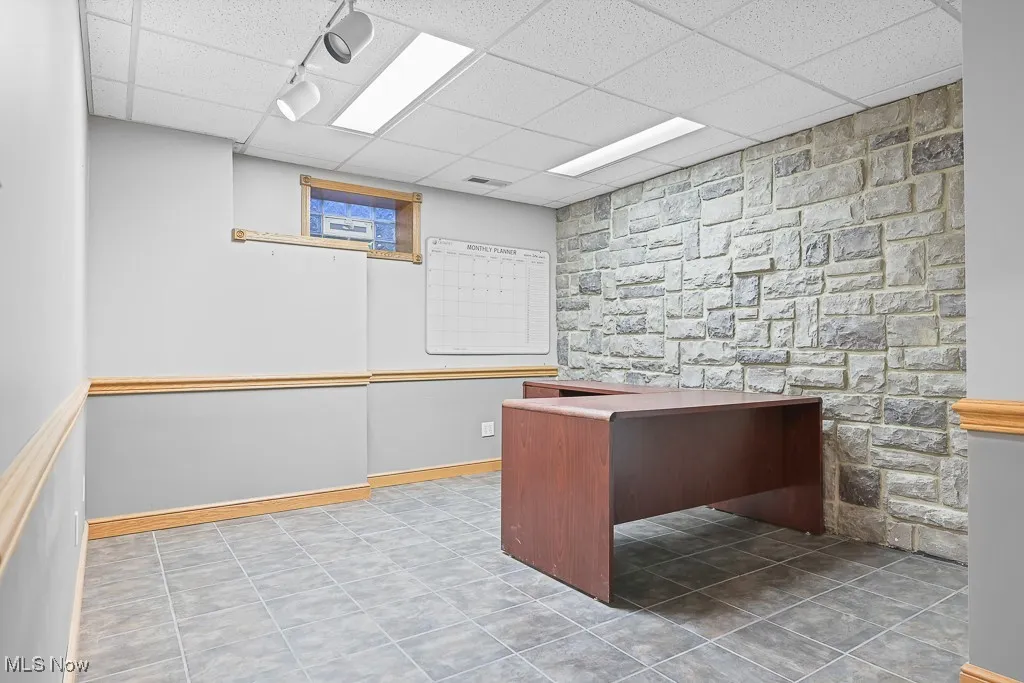 Unfurnished office featuring a paneled ceiling