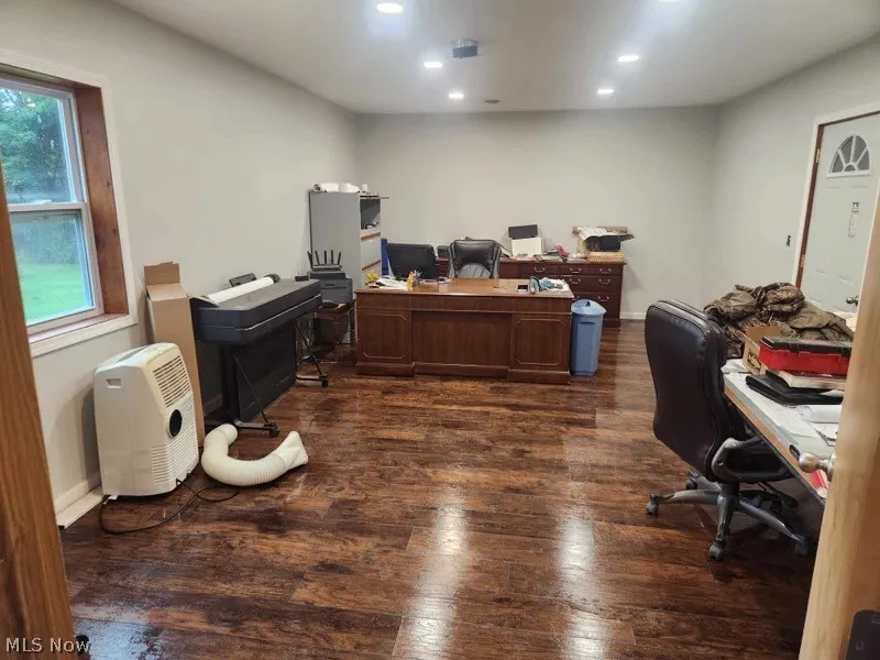 Office featuring dark hardwood / wood-style floors and a wealth of natural light