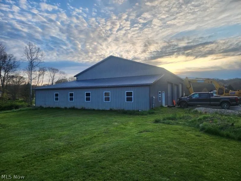Property exterior featuring a lawn