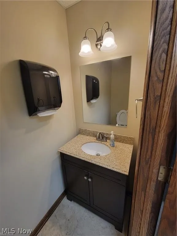 Bathroom featuring vanity and tile patterned flooring