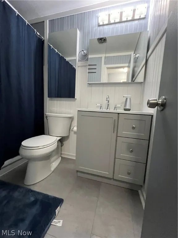 Bathroom with vanity and toilet
