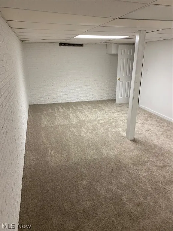 Basement featuring carpet flooring