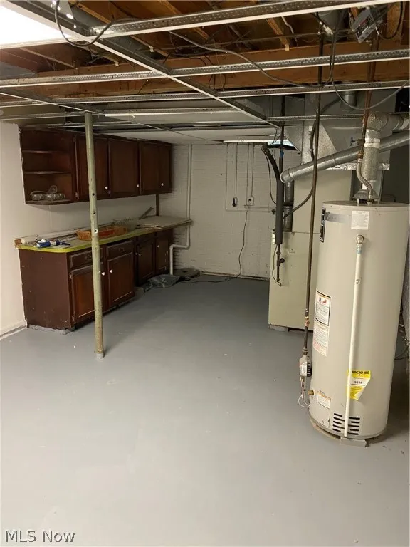 Basement featuring water heater