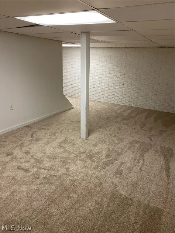 Basement featuring carpet