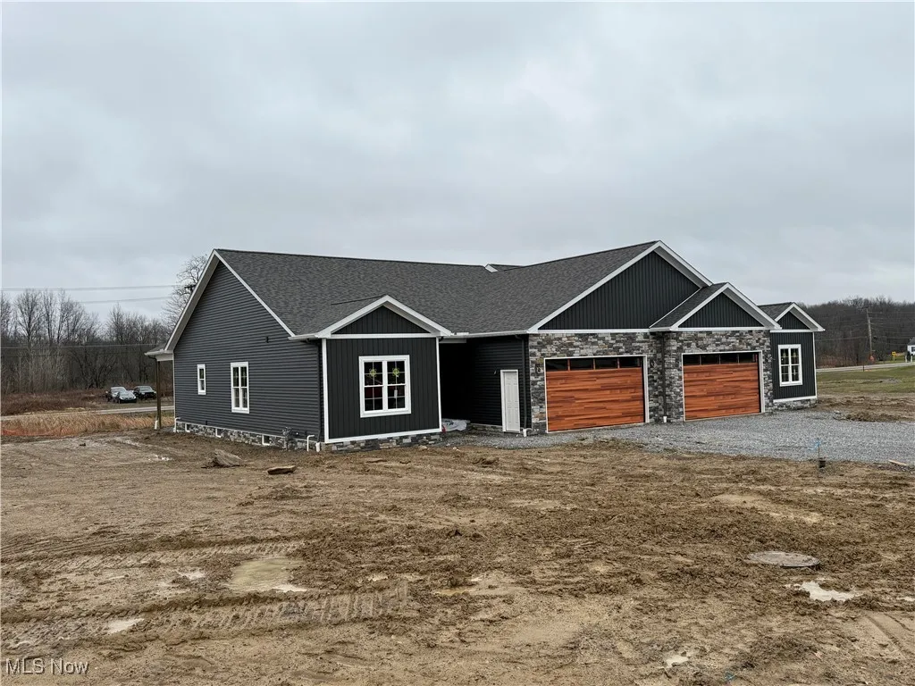 View of front facade featuring a garage