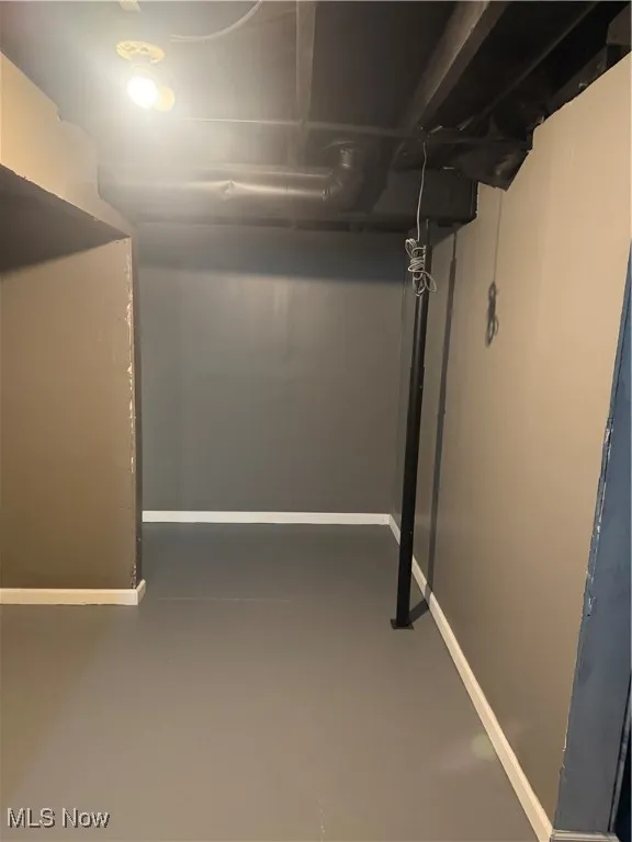 Basement featuring baseboards