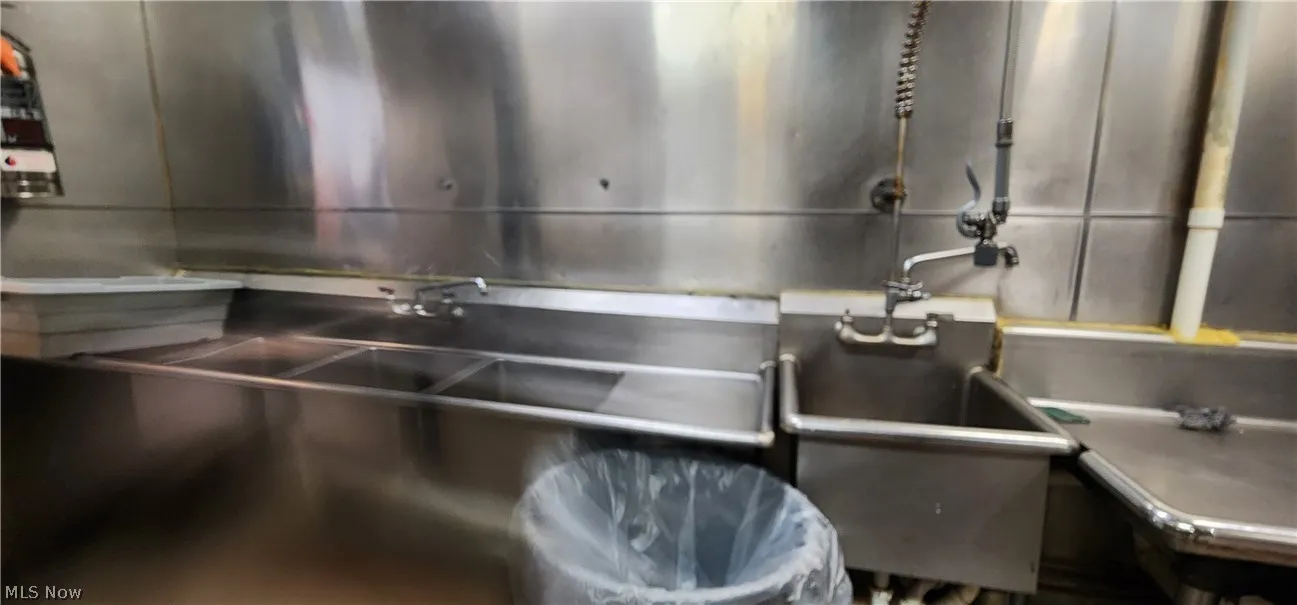 Room details with sink and stainless steel counters
