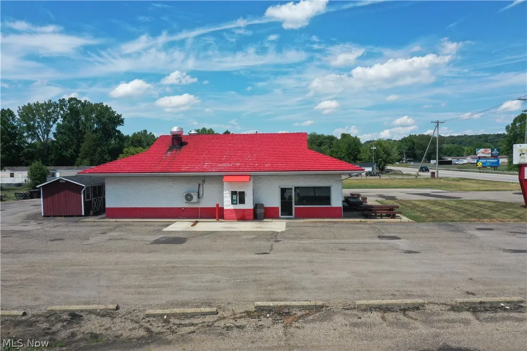 View of front of property with a shed
