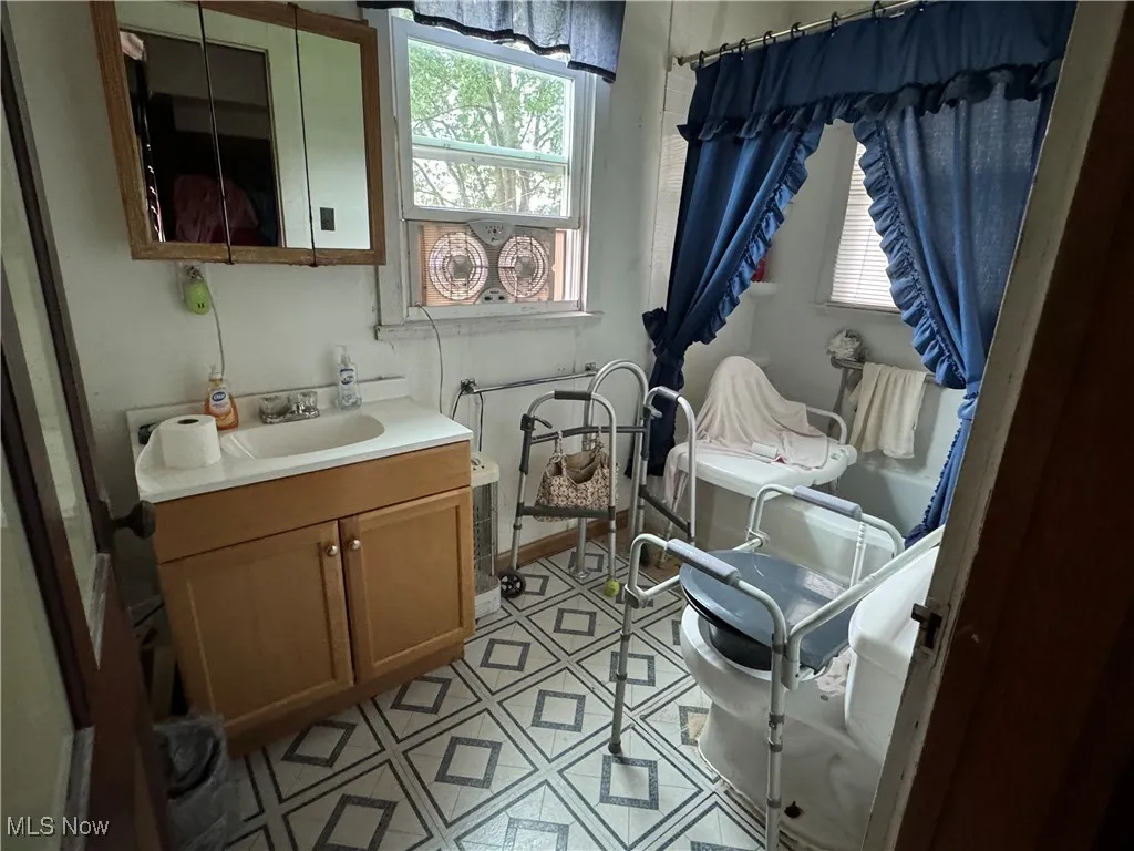 Bathroom featuring vanity and tile patterned floors
