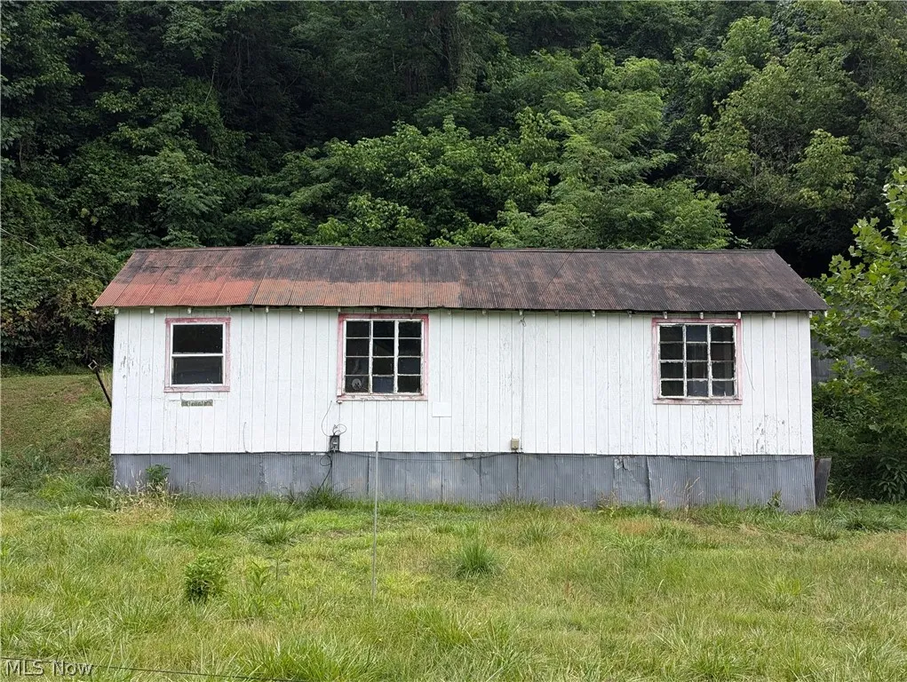 View of home's exterior featuring an outdoor structure