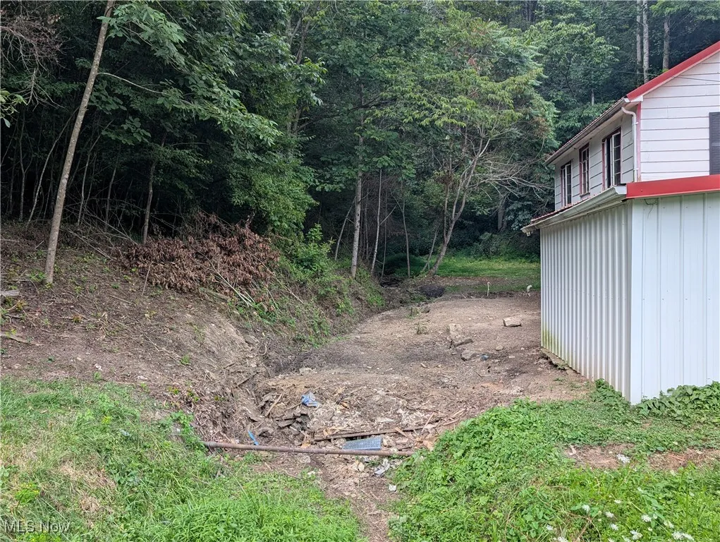 View of yard featuring a wooded view