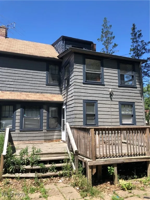 Rear view of house with a wooden deck
