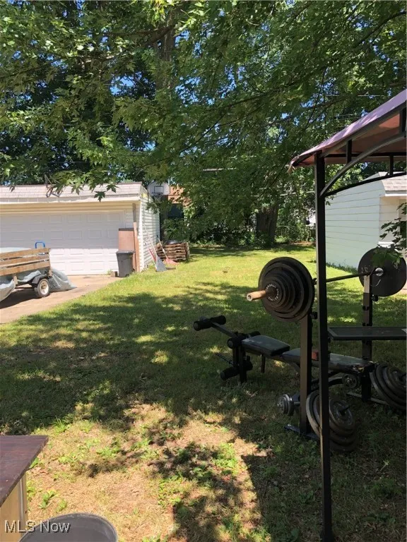 View of yard featuring a garage