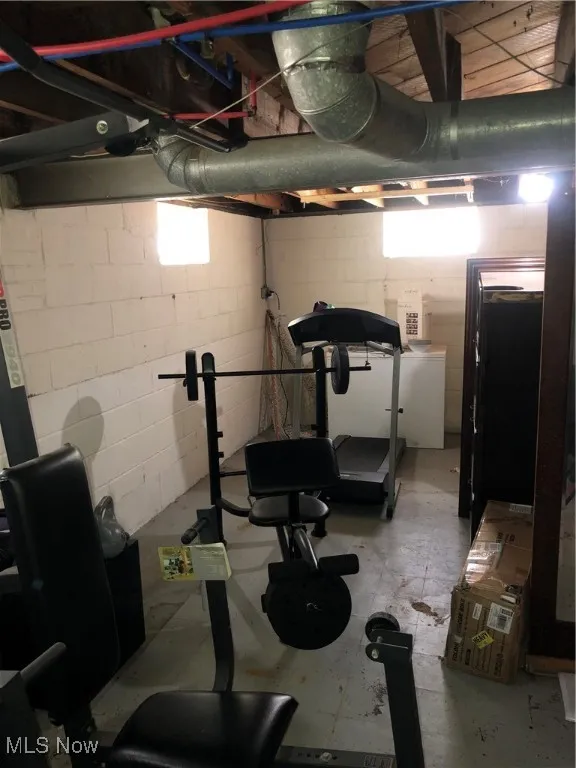 Workout room featuring concrete floors