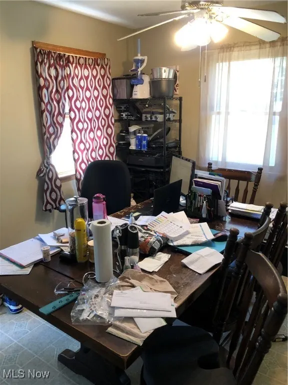Office featuring tile patterned flooring and ceiling fan
