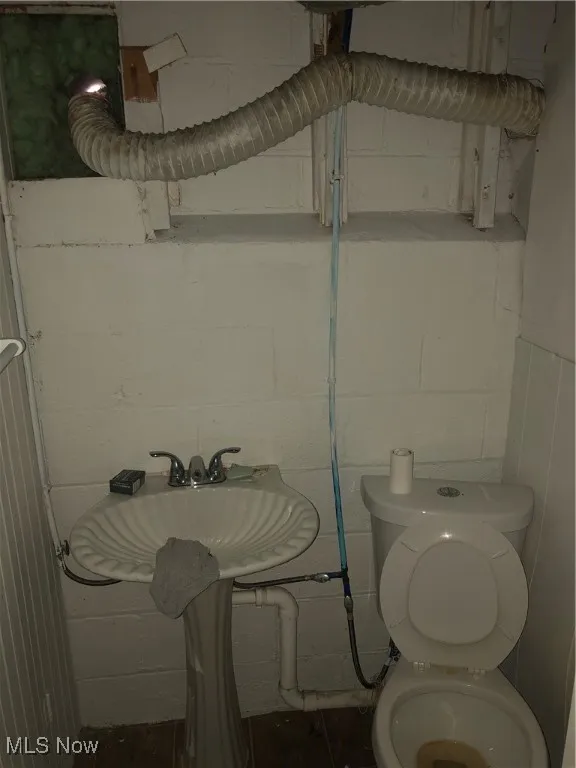 Bathroom featuring sink and toilet