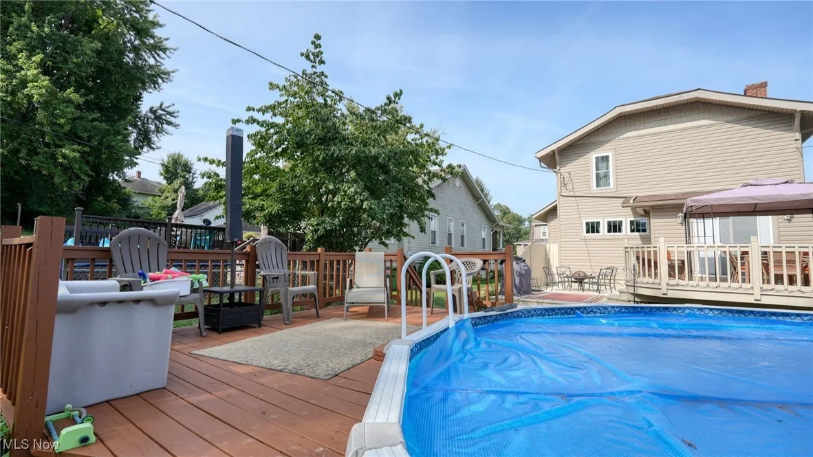 View of swimming pool featuring a wooden deck