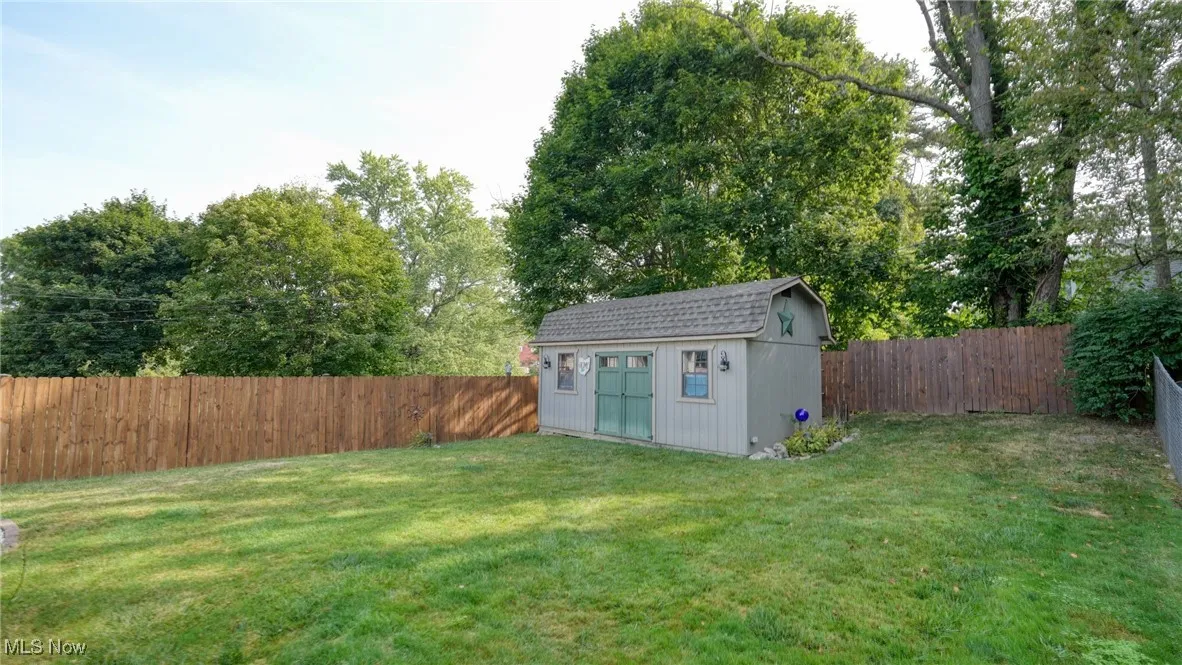 View of yard featuring a storage shed