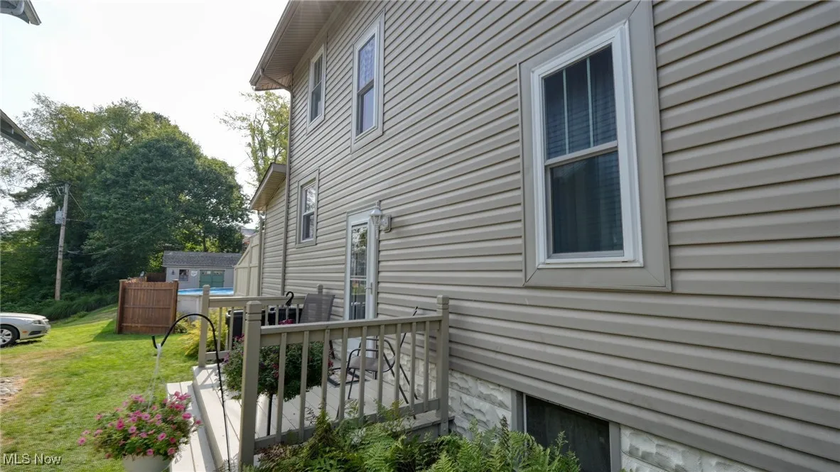 View of home's exterior with a yard