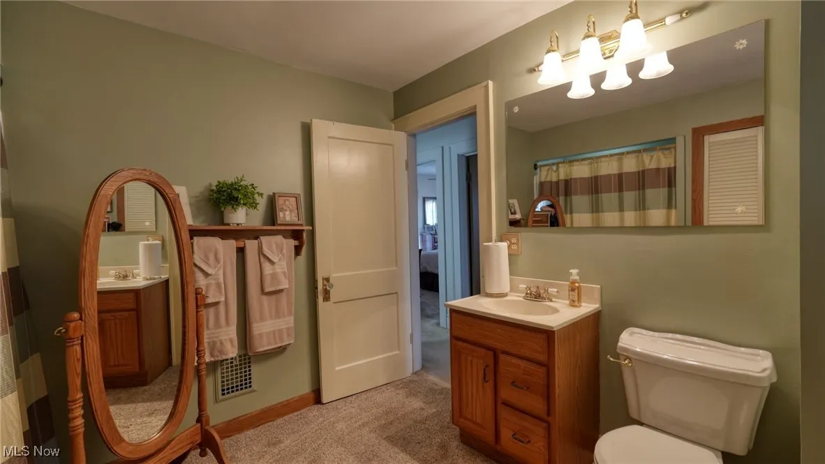 Bathroom with vanity and toilet