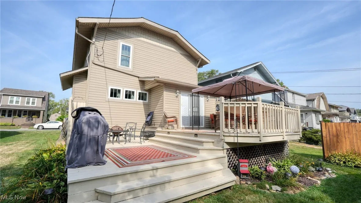 Back of property featuring a wooden deck