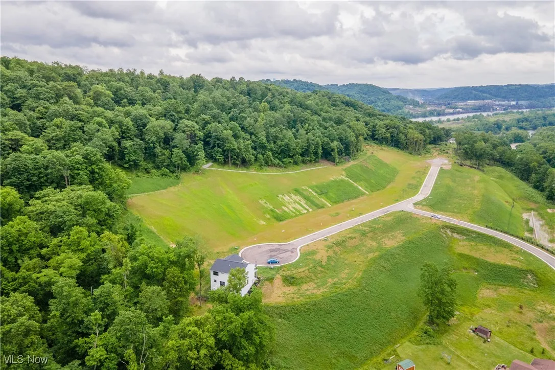 Birds eye view of property featuring a rural view