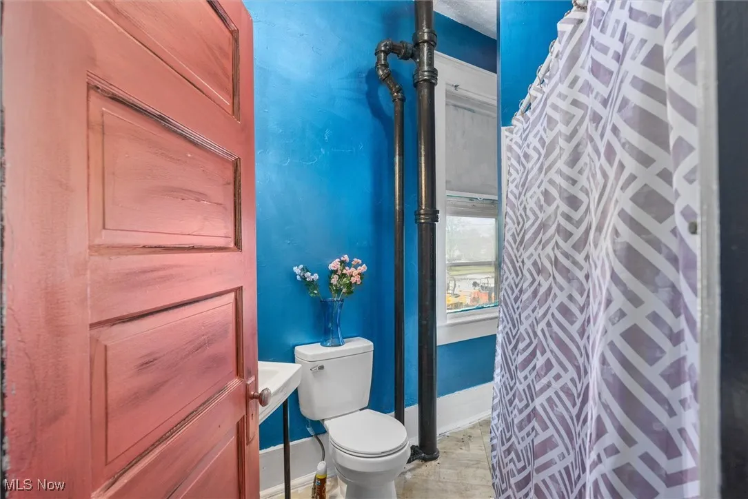 Bathroom with tile patterned flooring and toilet