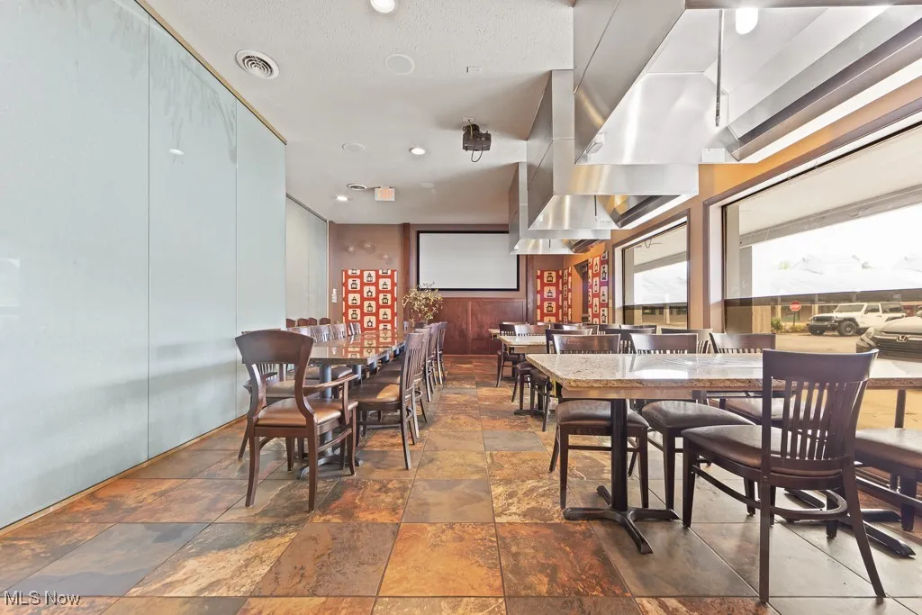 Dining area featuring dark tile patterned flooring