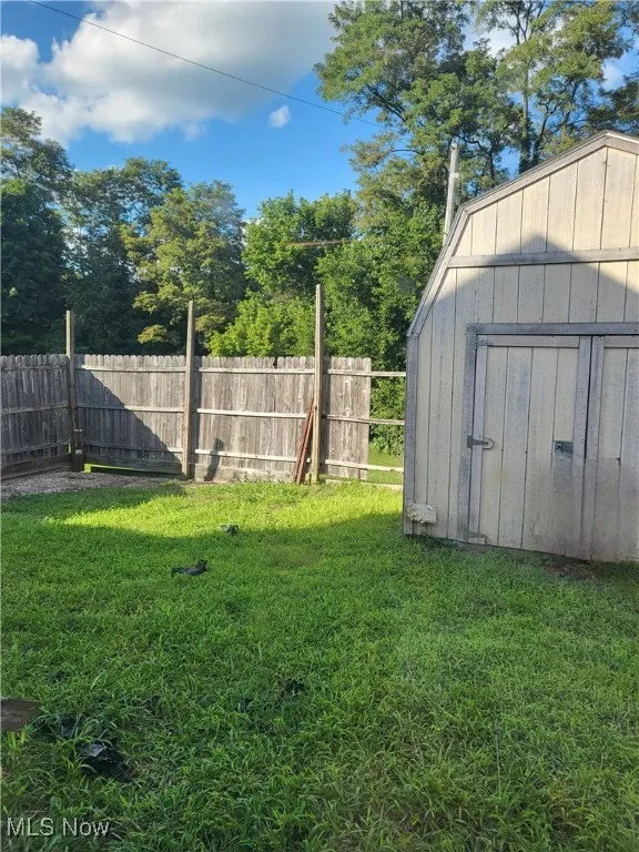View of yard with a storage unit