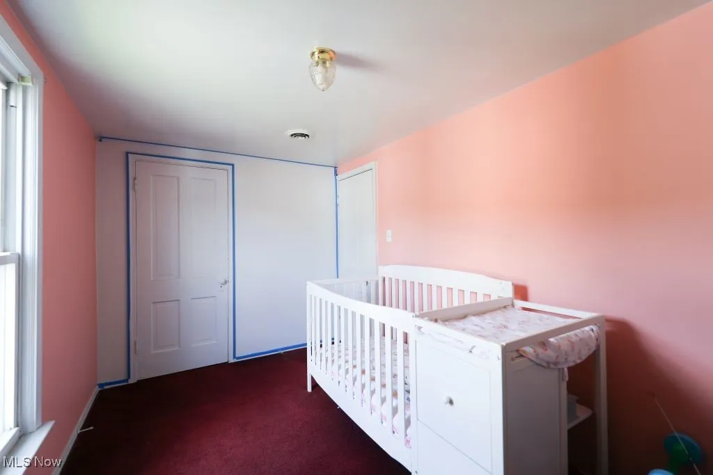 Another view of the freshly painted bedroom with closet.