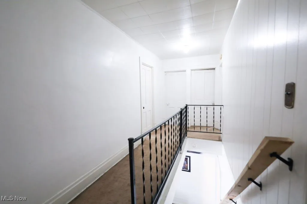 Upstairs carpeted hallway.  Pick a door to find a bedroom or the full bathroom.
