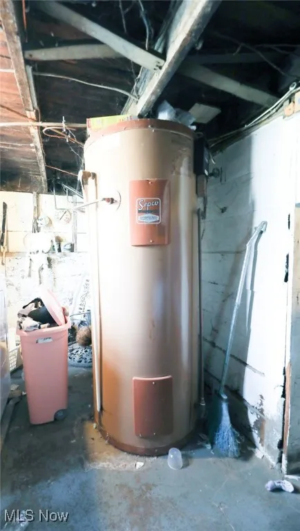 Utility room with water heater.